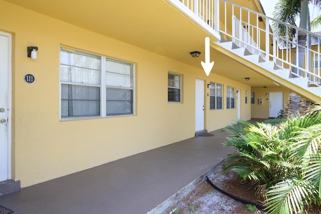 entrance to property with a balcony