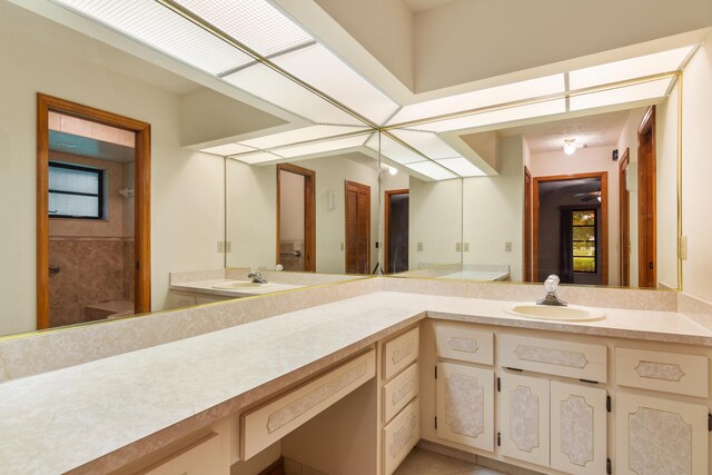 bathroom featuring vanity, walk in shower, and tile patterned floors