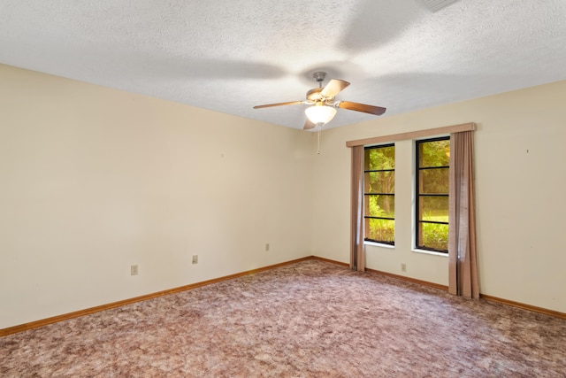 empty room with a textured ceiling, carpet floors, and ceiling fan