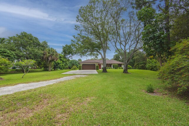 exterior space featuring a front lawn and a garage