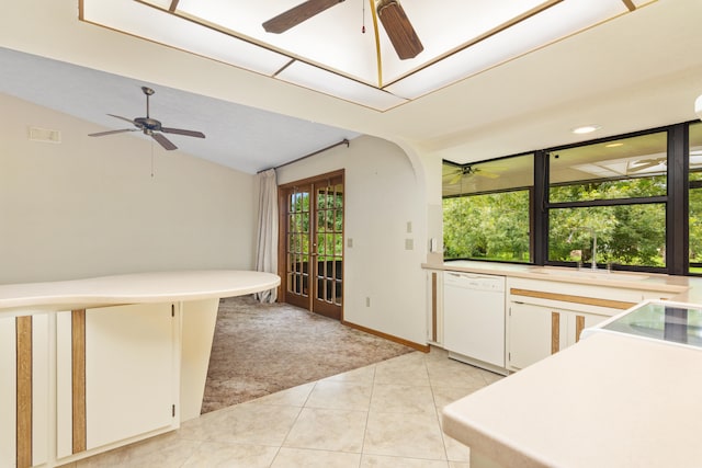 kitchen featuring dishwasher, white cabinetry, sink, light tile patterned floors, and ceiling fan