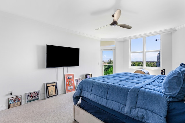 bedroom with carpet flooring, ceiling fan, and ornamental molding