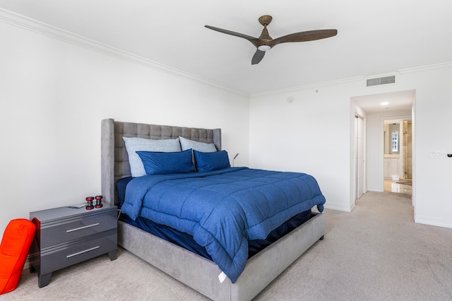 carpeted bedroom featuring ceiling fan and ornamental molding