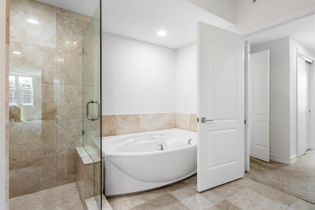 bathroom with plus walk in shower and tile patterned floors