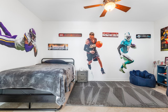 bedroom with ceiling fan and tile patterned flooring