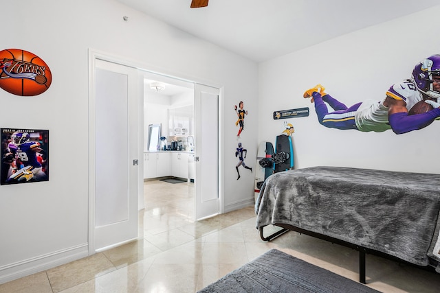 bedroom with ceiling fan and light tile patterned flooring