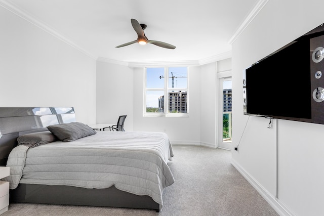 carpeted bedroom featuring crown molding, ceiling fan, and multiple windows