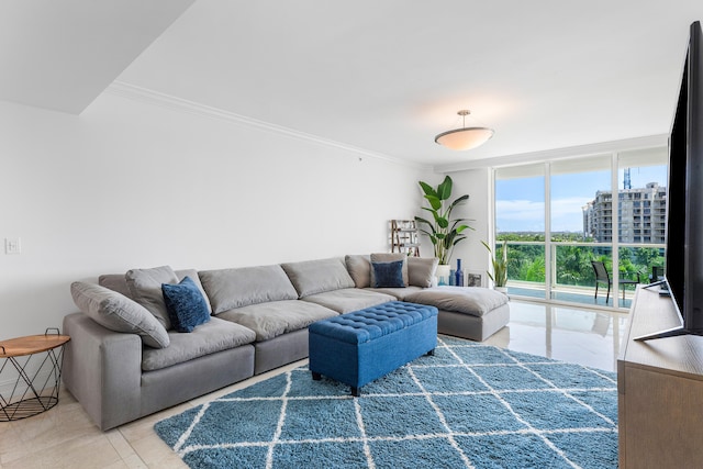 tiled living room featuring crown molding and a wall of windows