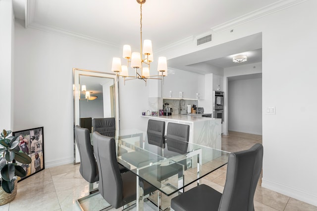 tiled dining room featuring sink, a chandelier, and ornamental molding