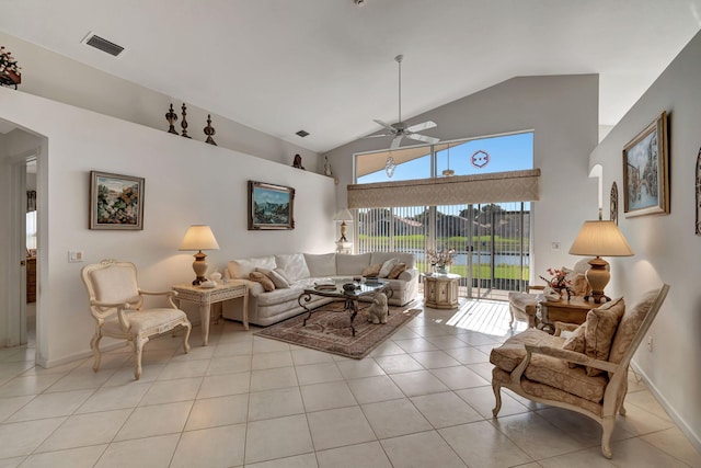 living room with light tile patterned floors, high vaulted ceiling, and ceiling fan