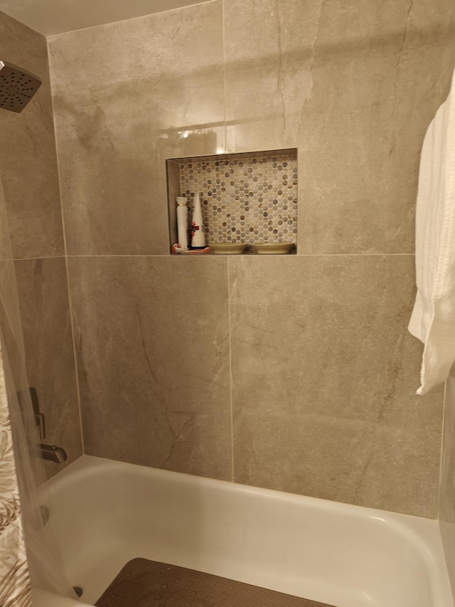 bathroom with shower / tub combo