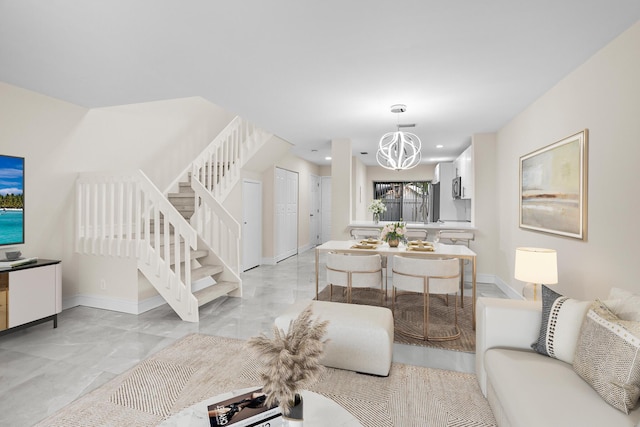 living area featuring a notable chandelier, marble finish floor, recessed lighting, baseboards, and stairs