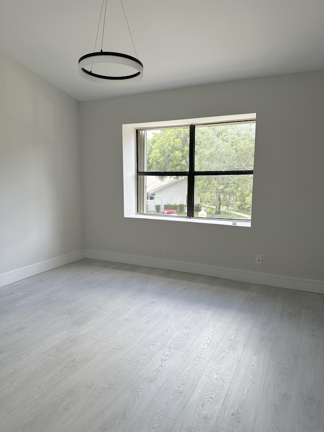 empty room with light wood-type flooring