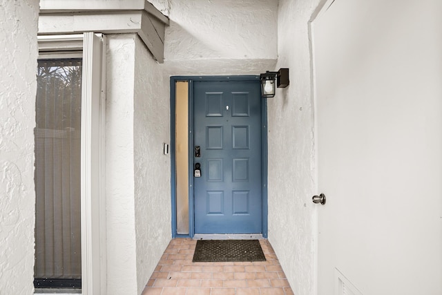 4820 NW 22nd St Unit 4134, Coconut Creek, FL 33063 - doorway to property featuring stucco siding
