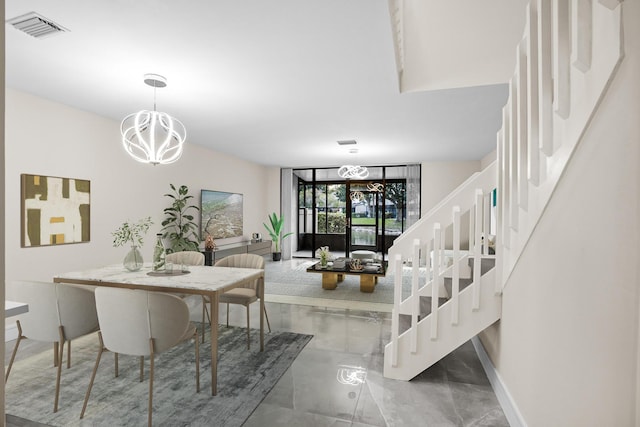 4820 NW 22nd St Unit 4134, Coconut Creek, FL 33063 - dining area featuring a chandelier, stairway, and baseboards
