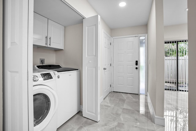 4820 NW 22nd St Unit 4134, Coconut Creek, FL 33063 - washroom with separate washer and dryer, cabinet space, light marble finish floors, baseboards, and recessed lighting