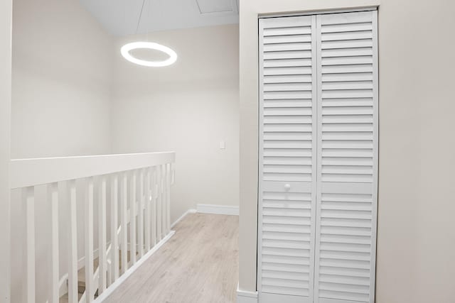 4820 NW 22nd St Unit 4134, Coconut Creek, FL 33063 - corridor featuring wood finished floors, attic access, and baseboards