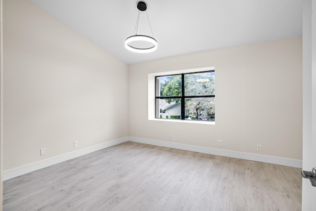 4820 NW 22nd St Unit 4134, Coconut Creek, FL 33063 - spare room with lofted ceiling, light wood-type flooring, and baseboards