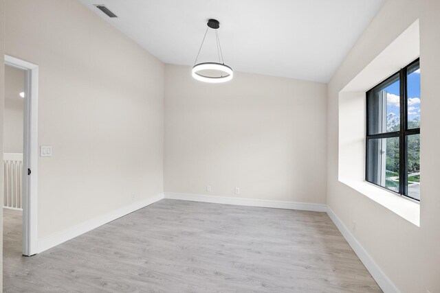 4820 NW 22nd St Unit 4134, Coconut Creek, FL 33063 - spare room with light wood-type flooring and baseboards