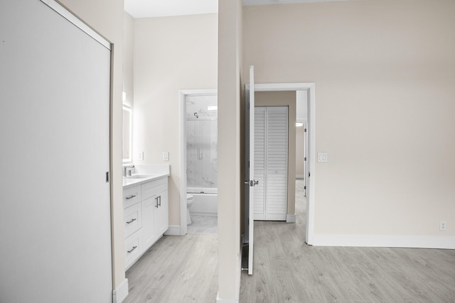 4820 NW 22nd St Unit 4134, Coconut Creek, FL 33063 - full bathroom featuring vanity, toilet, wood finished floors, shower / bathtub combination, and baseboards