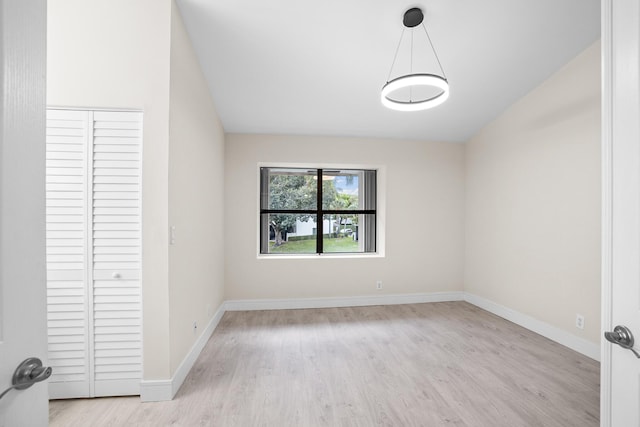 4820 NW 22nd St Unit 4134, Coconut Creek, FL 33063 - unfurnished bedroom featuring light wood-type flooring, baseboards, and a closet