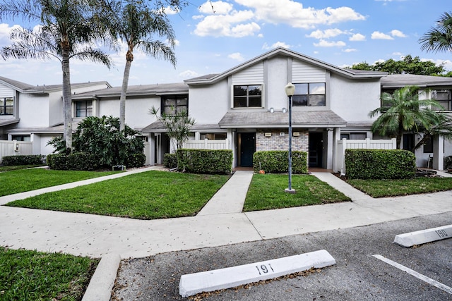 4820 NW 22nd St Unit 4134, Coconut Creek, FL 33063 - townhome / multi-family property featuring uncovered parking and stucco siding