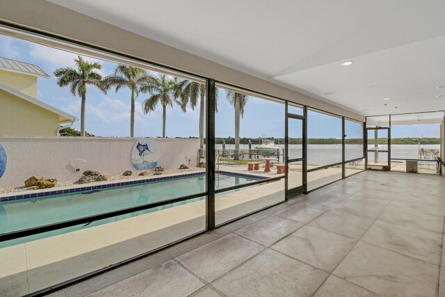 view of pool featuring a water view