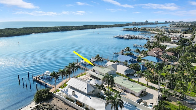 birds eye view of property with a water view