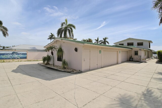 view of side of home with a patio