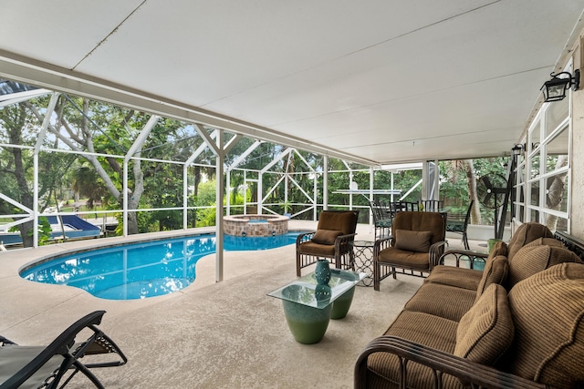 view of pool featuring a patio, a lanai, and an in ground hot tub