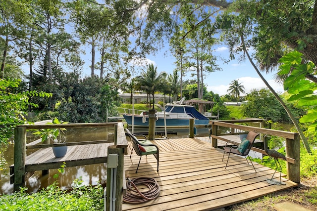 deck featuring a boat dock and a water view