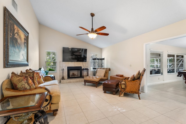 living room with ceiling fan, lofted ceiling, a fireplace, light tile patterned floors, and pool table