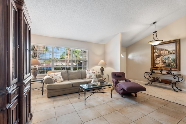 living room featuring light tile patterned floors, vaulted ceiling, and a textured ceiling