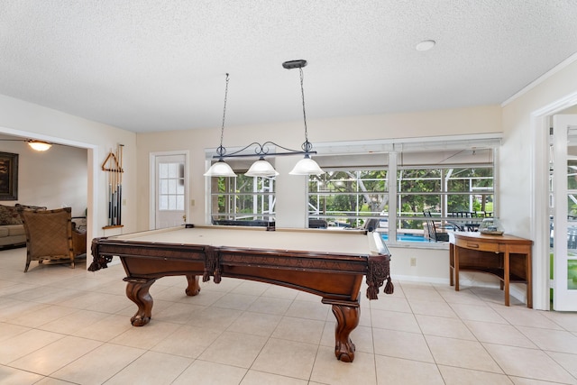 playroom featuring pool table, light tile patterned floors, and a textured ceiling