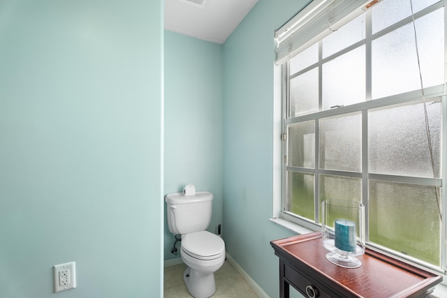 bathroom with vanity, toilet, and tile patterned flooring