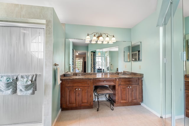 bathroom with tile patterned floors, vanity, and a shower with shower door