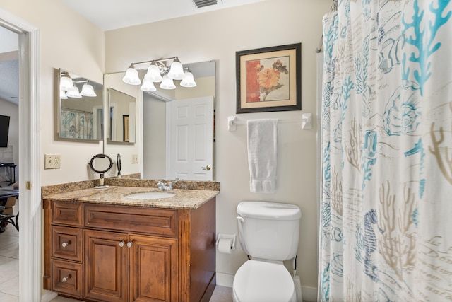 bathroom featuring a notable chandelier, vanity, toilet, and tile patterned flooring