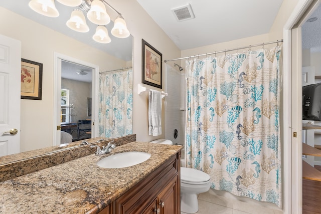 bathroom with vanity, tile patterned floors, a chandelier, and toilet