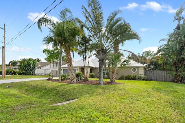 single story home featuring a front yard