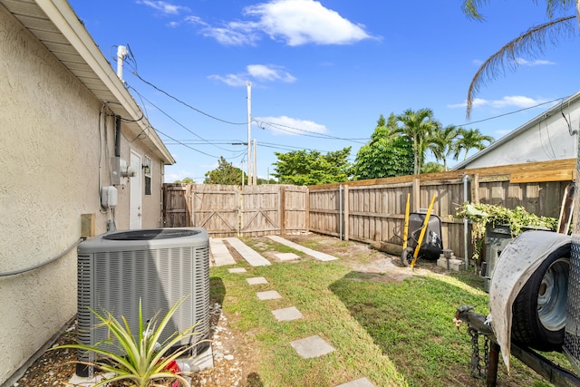 view of yard featuring central air condition unit