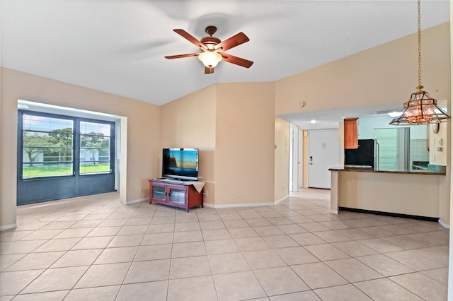 unfurnished living room featuring ceiling fan, vaulted ceiling, and light tile patterned floors