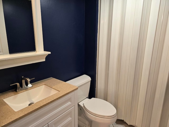 bathroom with vanity and toilet