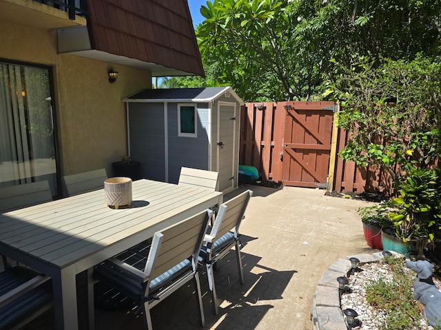 view of patio with a storage unit