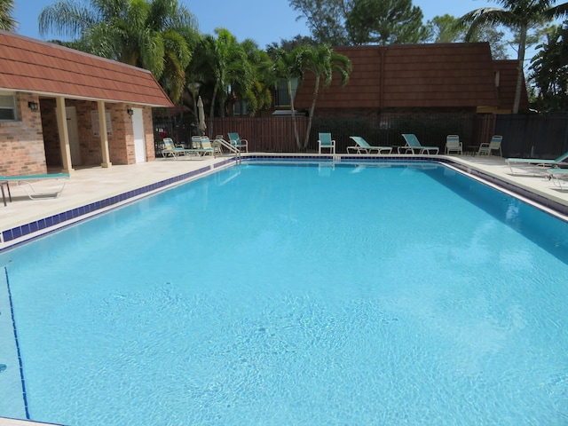 view of swimming pool with a patio area