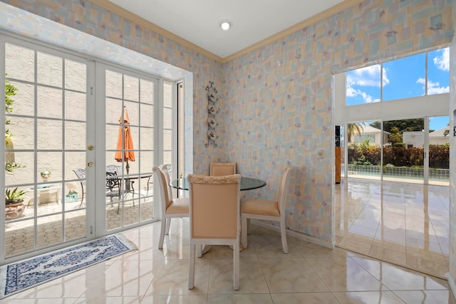 dining room featuring french doors, light tile patterned floors, and a wealth of natural light