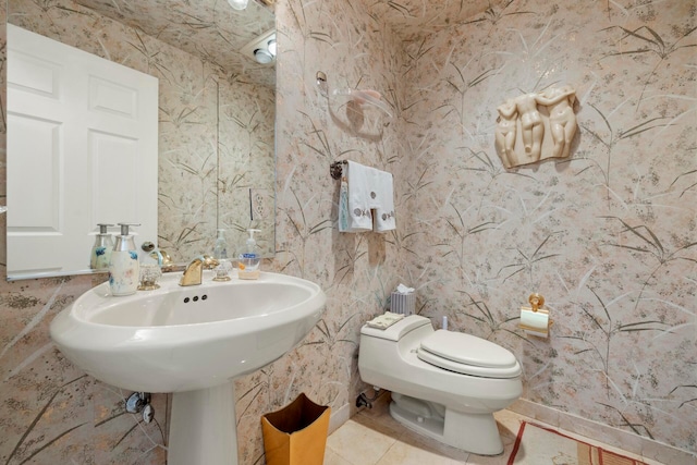 bathroom featuring toilet and tile patterned floors