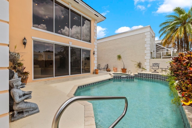 view of pool featuring a lanai and a patio area