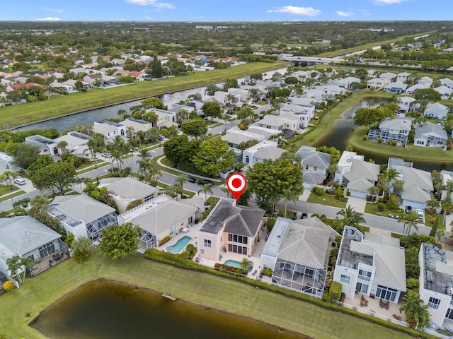 bird's eye view with a water view and a residential view