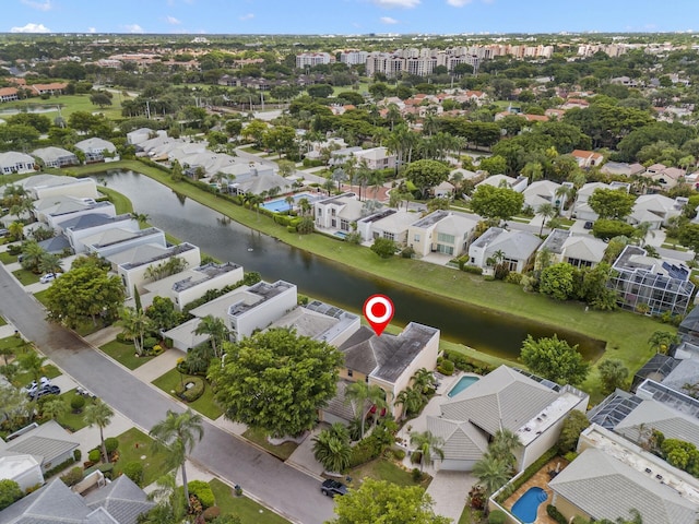 bird's eye view featuring a water view and a residential view