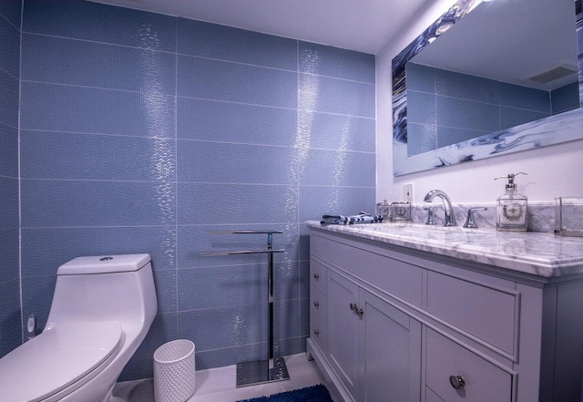 bathroom with toilet and vanity